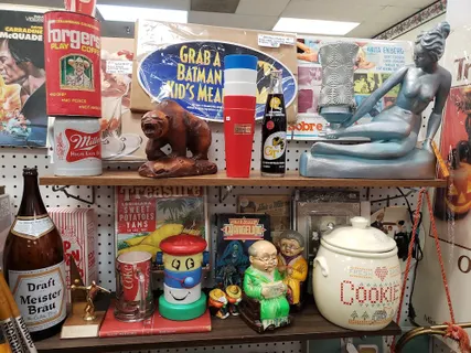 Colorful collection of vintage signs, ceramics, and curios